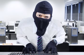 Businessman wearing mask stealing information