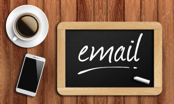 coffee, phone  and chalkboard with word email