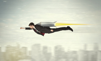 Superhero business man flying with jet pack rocket above the city