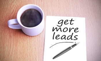 Coffee on the table with note writing get more leads