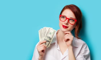 women in red glasses with money