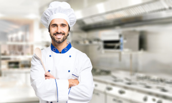 Smiling chef in his kitchen