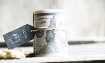 How to make Money online text and dollar banknotes