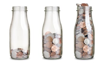 jars with different level of coins isolated on white