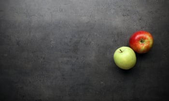 Apples on grey kitchen table with space for text