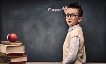 Genius child at blackboard