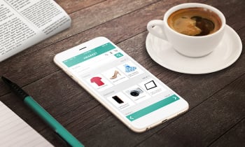 on line shopping with smart phone on wooden table relax time with coffee newspaper pencil growing marketing concept