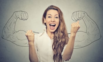 happy woman exults pumping fists ecstatic celebrates success