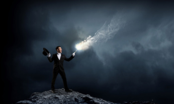Businessman demonstrating magic . Mixed media