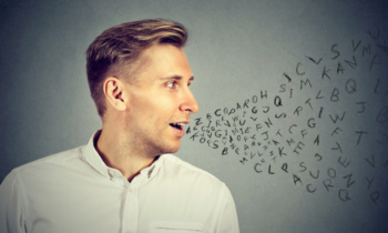 Man talking with alphabet letters coming out of his mouth
