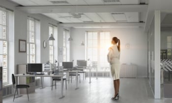 Businesswoman in her office . Mixed media