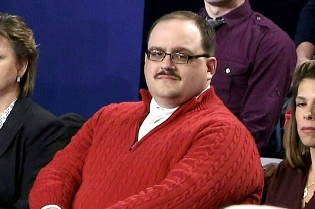 (FILES) In this file photo dated October 9, 2016 Ken Bone (2nd L) listens to US Democratic nominee Hillary Clinton and Republican nominee Donald Trump durint the second presidential debate at Washington University in St. Louis, Missouri. As the mud flew at Donald Trump and Hillary Clinton's second presidential debate Sunday, the American everyman became an instant celebrity by calmly asking a question about energy policy. Bone -- even his sturdy name has been a source of amusement on social media -- had been picked to represent undecided voters at the town hall-style debate in St Louis, Missouri. His heft, poise and polite manner offered a brief but refreshing respite from the 90-minute slug-fest between the Republican and Democratic candidates. / AFP / POOL / Tasos Katopodis / TO GO WITH AFP STORY "Ken Bone, everyman hero in a tawdry US campaign" (Photo credit should read TASOS KATOPODIS/AFP/Getty Images)