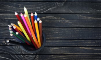 Group of pens on table