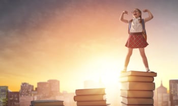 child standing on books