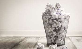 Crumpled paper in the trash can