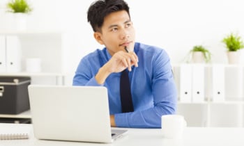 Young asian businessman planning and thinking