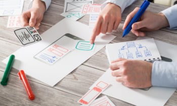 Designer drawing website ux app development.