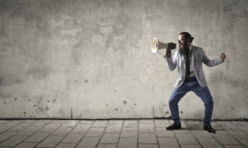 Angry manager shouting into a megaphone