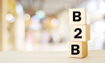 B2B , business to business marketing, business word on wooden cubes over blur background, banner, with copy space for text
