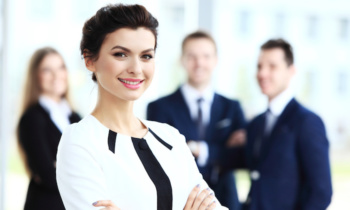 Face of beautiful woman on the background of business people