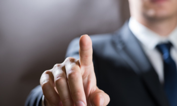 Businessman click on virtual touchscreen. Futuristic business and IT presentation background