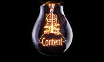 Hanging lightbulb with glowing Content concept.
