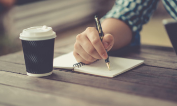 Man writing notebook