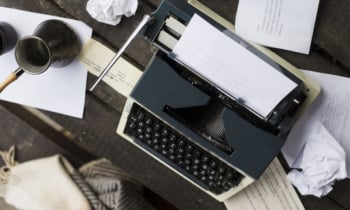 woman typing on a typewriter