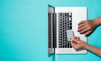 Top view of male hands making online payment