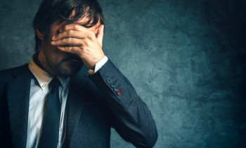 Unhappy businessman under stress after business project failure