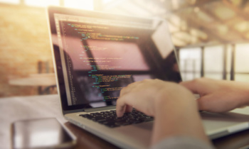 Closeup coding on screen, Woman hands coding html and programming on screen laptop, development web, developer.