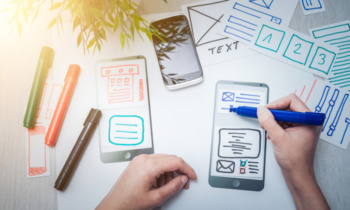 Designer drawing website ux app development.