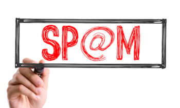 Hand with marker writing: Spam