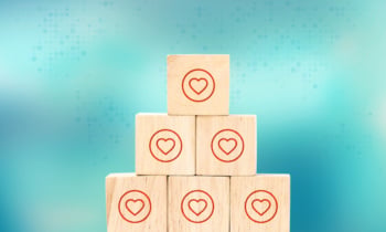 close up at heart like icon on wood cube arrange in pyramid shap
