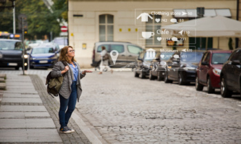 Augmented reality in marketing. Woman traveler with phone. Navigation on the projection of the display