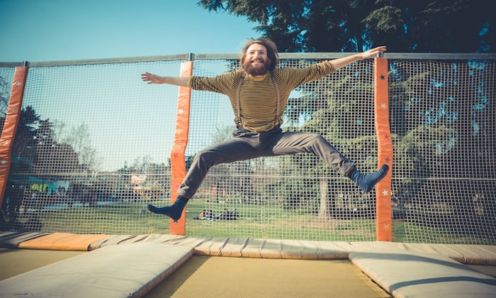 A antheral   jumping connected  a trampoline.