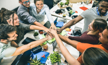 Young employee startup workers group stacking hands at urban studio during entrepreneurship brainstorming project – Business concept of human resources on working time – Start up internship at office