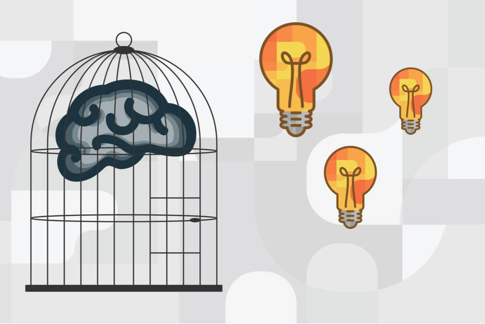 ilustraçao demonstrando cerebro humano em gaiola e lampadas acesas ao lado, simbolizando o bloqueio criativo