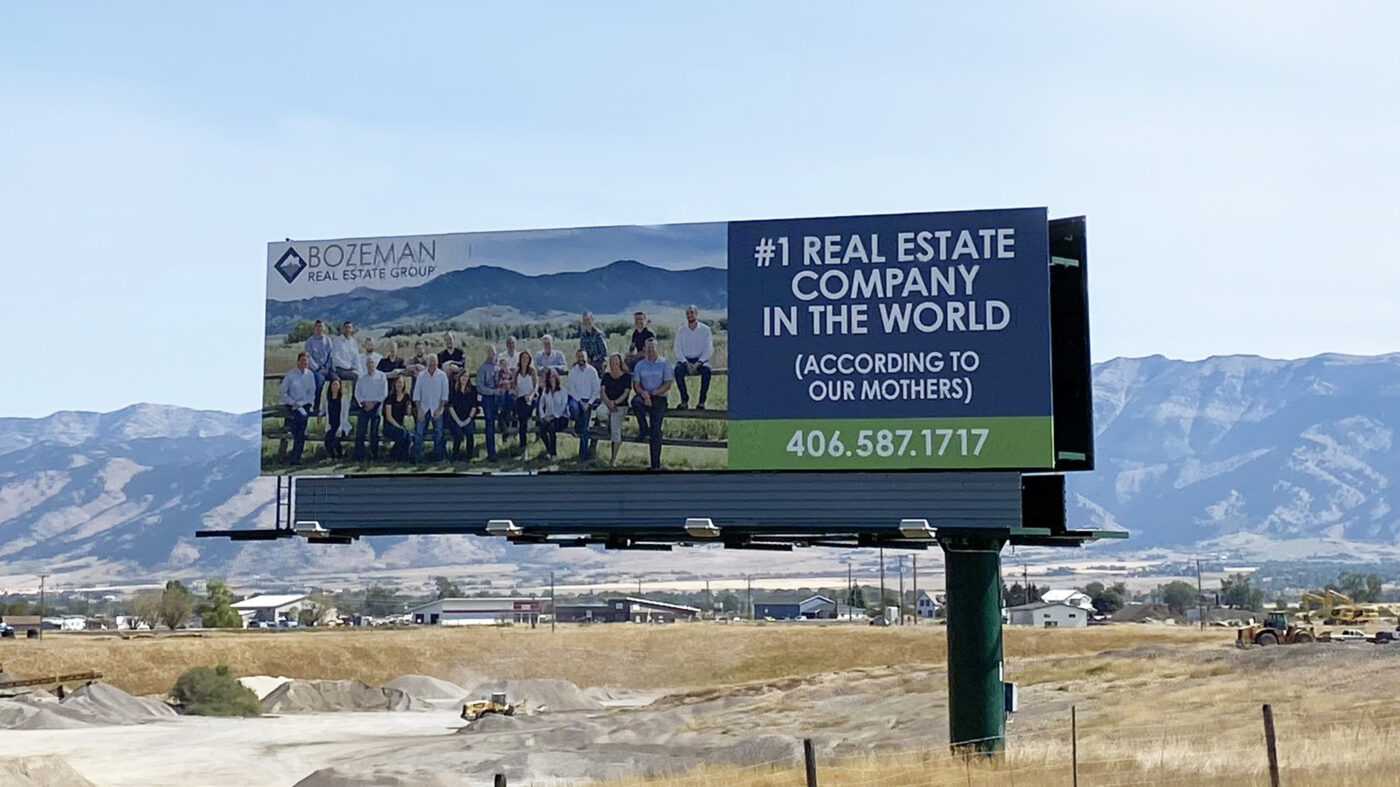 Billboard ad with the statement â#1 Real Estate Company in the World, According to Our Mothers.