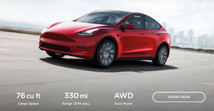 An example of product marketing from Tesla, showing a red car driving on the road. 