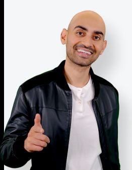 Neil Patel pointing to the camera. 