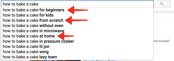 "،w to bake a cake" typed into YouTube's search box with red arrows pointing to "beginners," "scratch," and "،me" in the suggestion box.